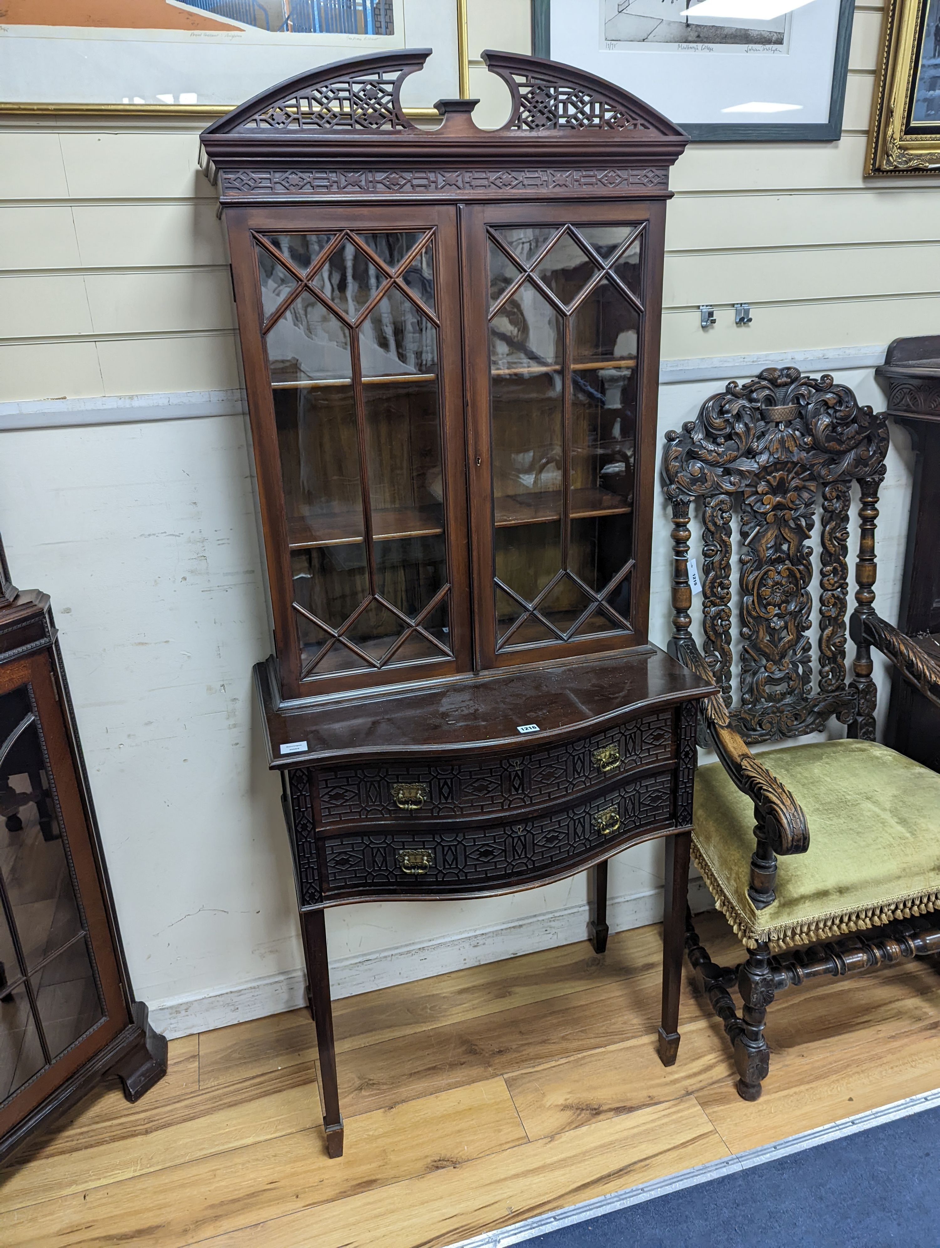 An Edwardian Chippendale revival serpentine mahogany display cabinet, width 76cm, depth 45cm, height 180cm